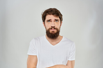 Bearded man gesturing with hand white cropped t-shirt studio lifestyle