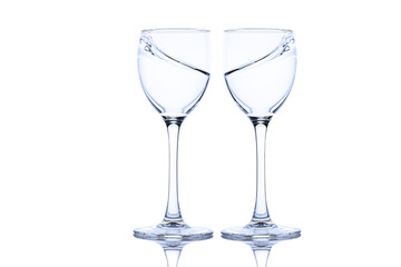 Splash of liquid in glasses isolated on white background