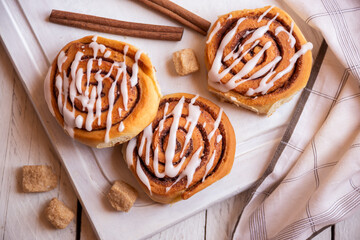 Fresh home baked sweet cinnamon buns with frosting
