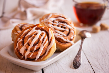 Fresh home baked sweet cinnamon buns with frosting