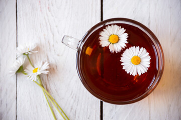 Cup of chamomile tea, natural herbal aroma drink