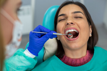 Portrait of the woman with a beautiful smile at the dentist.