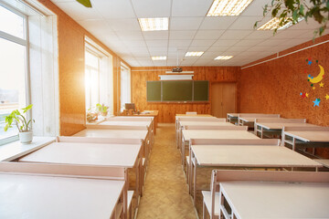 Interior of an empty school classroom. Concept of coronavirus COVID-19 quarantine in schools and educational institutions