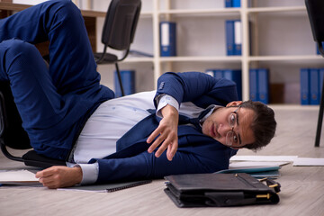 Young male businessman employee unhappy with his work