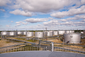 Tanks for storing petroleum products in a large industrial area. View from the oil reservoir.