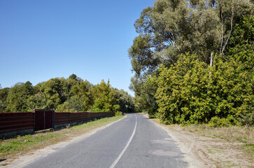 Asphalt twisty suburban road. A bend road at rural Europe