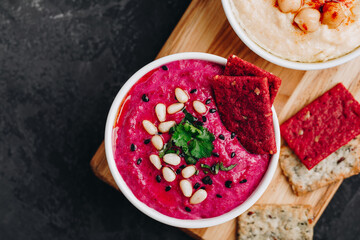 Beetroot Beet Hummus with crispbread. Healthy vegan dip
