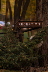 Reception sign nailed to a tree