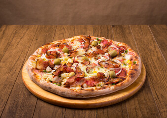 Complete Portuguese Pizza accompanied by a glass of red wine. Gastronomic photography with centralized elements.