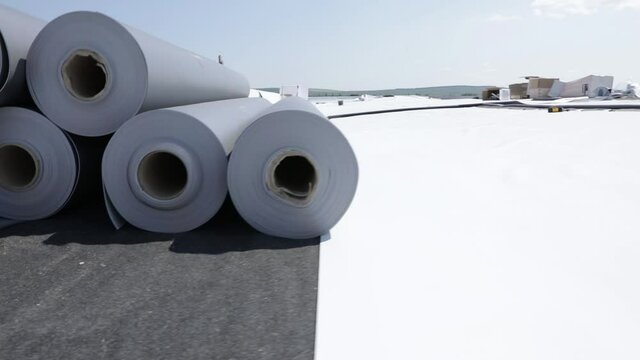 Stack of synthetic pvc membrane rollers on a flat roof