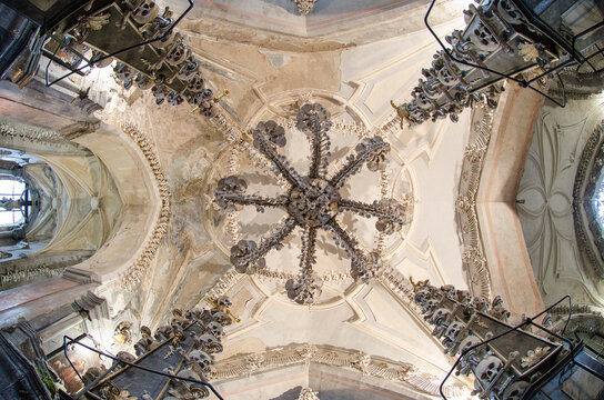 KUTNA HORA, CZECH REPUBLIC - August 14, 2019: Interior of the ossuary in Sedlec Kostnice. Ossuary Contain Skeletons about 50,000 People, Whose Bones Been Arranged To Form Decorations For Chapel.
