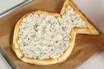 Place filling on prepared pastry. Making Salmon in Puff Pastry Series.