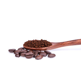 Obraz premium Coffee beans with ground coffee in a spoon on a white background