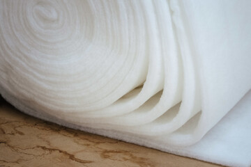 Closeup of a roll of white padding for furniture