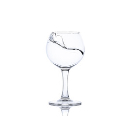 A splash of  water in a glass for wine. Water splashes. 