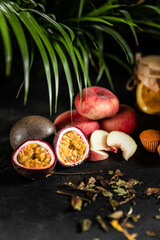 Fruit hot tea with the addition of oranges, lemons, mandarins and raspberries in a glass cups on a table. Healthy hot drink. tea with fruit and berries in a glass teapot. tea for colds.