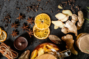 Fruit hot tea with the addition of oranges, lemons, mandarins and raspberries in a glass cups on a table. Healthy hot drink. tea with fruit and berries in a glass teapot. tea for colds.