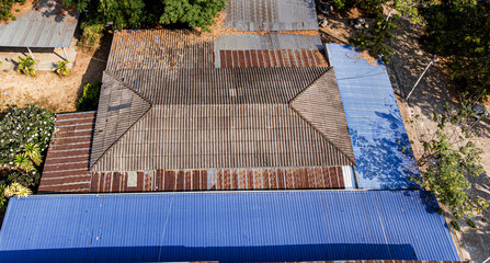 An old rusty roof shot by aerial view.

