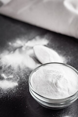 baking soda powder on a dark stone background