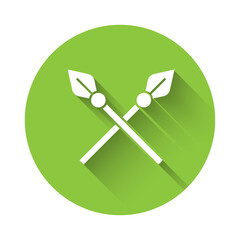 White Crossed medieval spears icon isolated with long shadow. Medieval weapon. Green circle button. Vector.