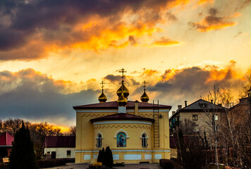 fiery sunset over the church