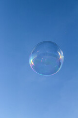 Soap bubble in the blue sky