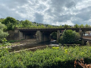 Fototapeta premium View of the bridge, over the River Calder, on a very cloudy day in, Sowerby Bridge, Halifax, UK