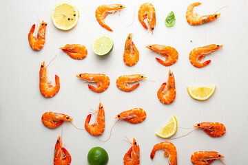 Tiger  Shrimps with lime on white surface