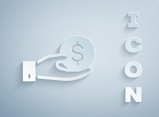 Paper cut Human hand giving money icon isolated on grey background. Receiving money icon. Paper art style. Vector.