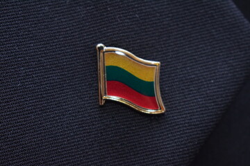 Lithuania flag lapel pin on a suit