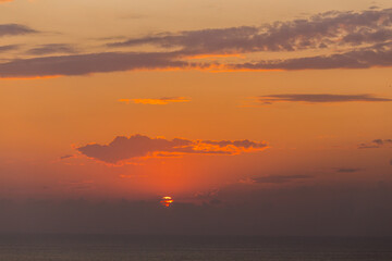 Beautiful sunset over the sea orange coclor.