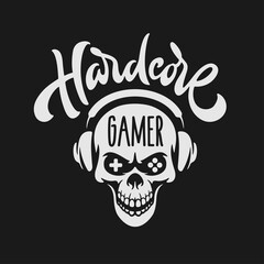Video games related t-shirt design. Angry skull in headphones. Hardcore gamer quote text phrase quotation. Vector vintage illustration.