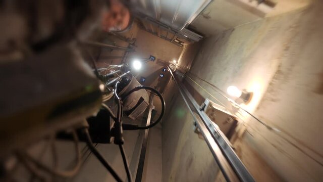 Passage in the Elevator shaft tunnel. Elevator shaft of a multi-storey building. Travel through the tunnel. Debugging of Elevator equipment. Preparing to install the Elevator cab. Major renovation of 