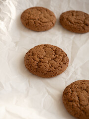 Oatmeal cookies on white background in morning light close up