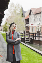 Woman at city, plus size blonde nice woman outdoor portrait. Pretty nice lady in fashionable warm outfit, lifestyle, shopping time, woman at walk