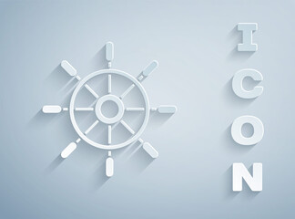Paper cut Ship steering wheel icon isolated on grey background. Paper art style. Vector.