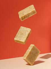 Organic soap bars made from natural products levitating in the air.