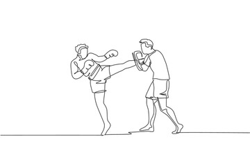 One continuous line drawing of young sporty man kickboxer athlete training with personal trainer who hold punch bag at gym center. Combative sport concept. Single line draw design vector illustration