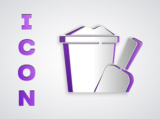 Paper cut Sand in bucket with shovel icon isolated on grey background. Plastic kid toy. Summer icon. Paper art style. Vector.
