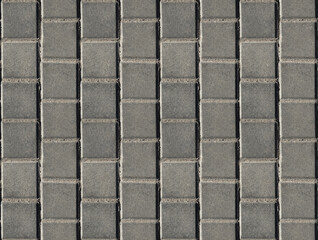 Coating with modern textured paving tiles of square shape.