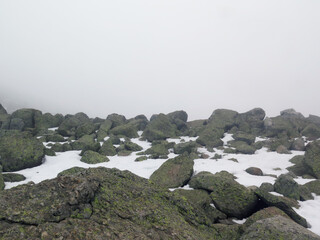 high mountain in fog