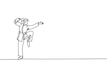 One continuous line drawing young wushu master woman, kung fu warrior in kimono pose stance balance on training. Martial art sport contest concept. Single line draw graphic design vector illustration