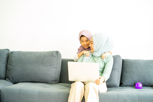 Woman Sitting On Sofa With Laptop Muslim Mother Business Woman Work From Home