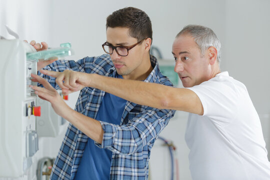 man pointing at a button