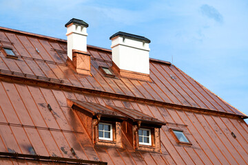 Close-up of a copper roof against blue sky