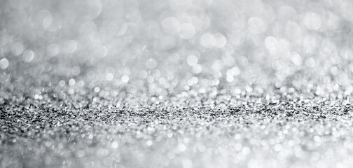 Abstract silver glitter sparkle texture with bokeh background