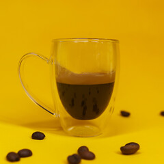 cup of coffee on yellow background. isolated