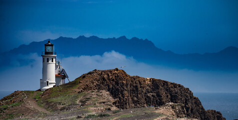 Fototapeta na wymiar Lighthouse on Anacapa Island, Channel Island National Park with California coast in distance