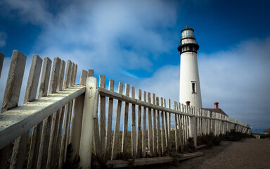 Pigeon Point Lighthouse, Central coast California with dramatic blue sky and clouds