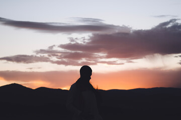 silhouette of a person in the desert